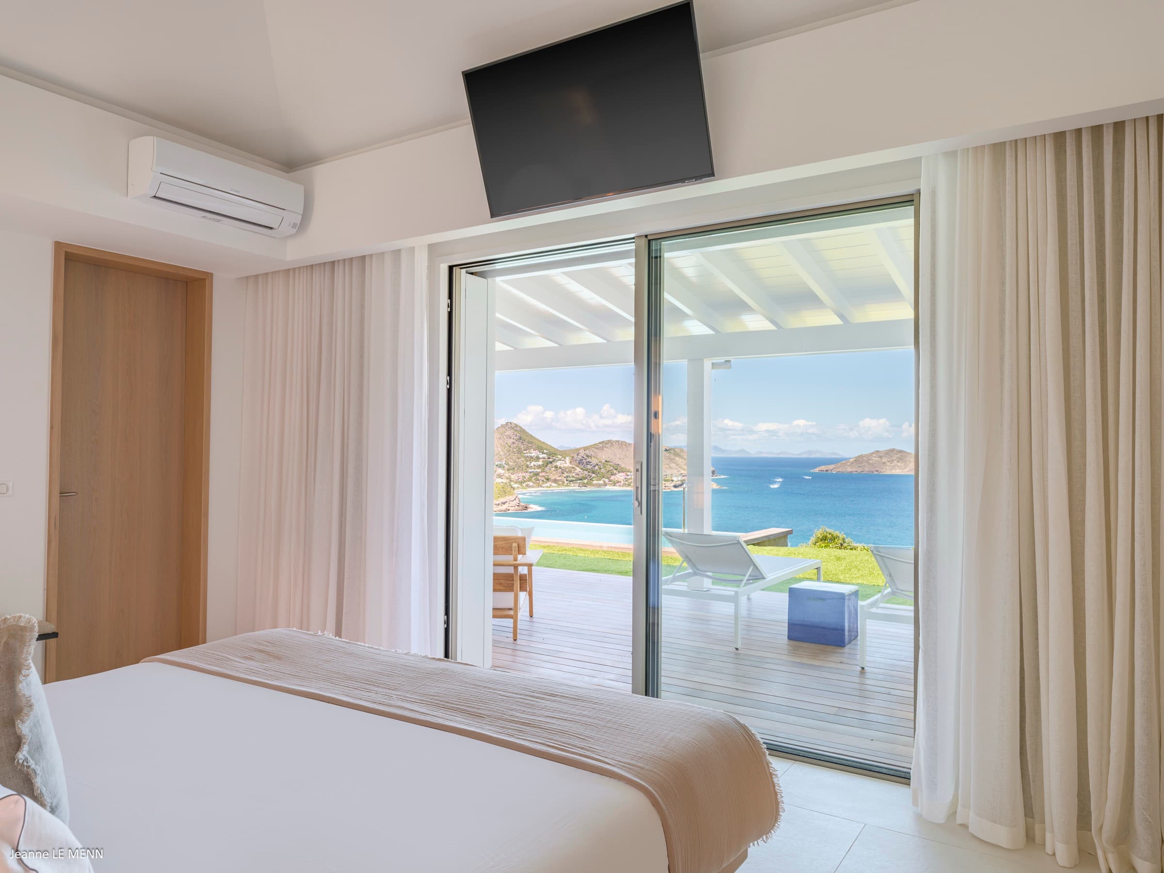 Master bedroom with ocean view and terrace access